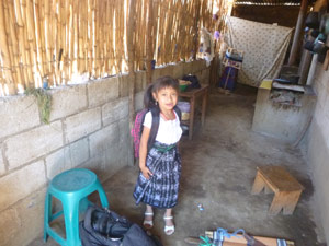 photo of Mayan girl in typical Mayan house