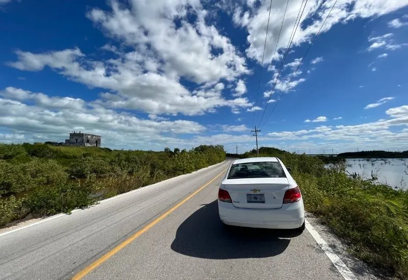 photo of a car on a road in the Yucatan