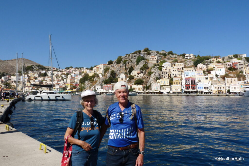 Heather & Norm by the harbour of Symi Island Greece