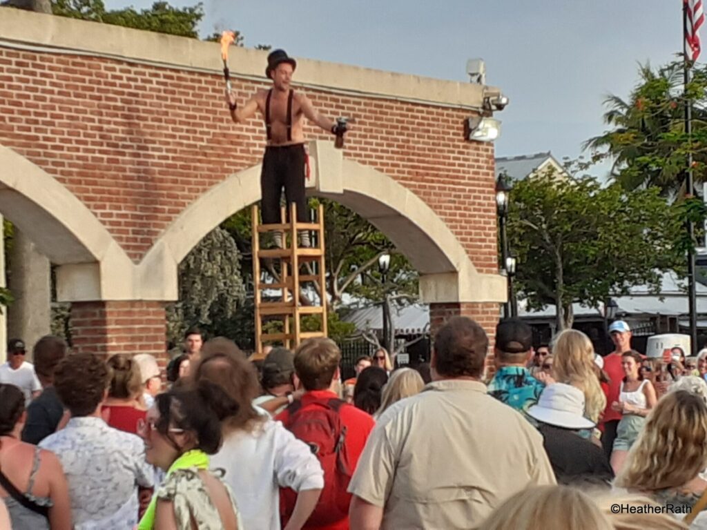 busker with fire wand at Mallory Square