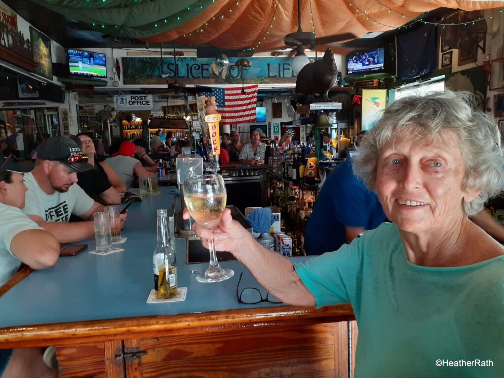 Heather enjoys her wine at the Green Parrot bar