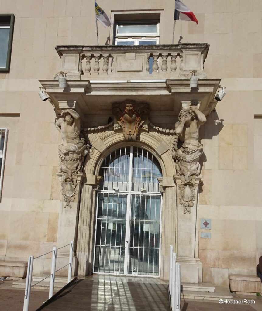 Entrance to old city hall with figures by Pieere Puget