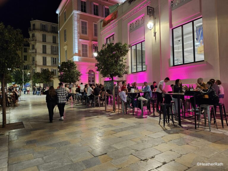 photo of people dining and drinking outside on a pleasant evening