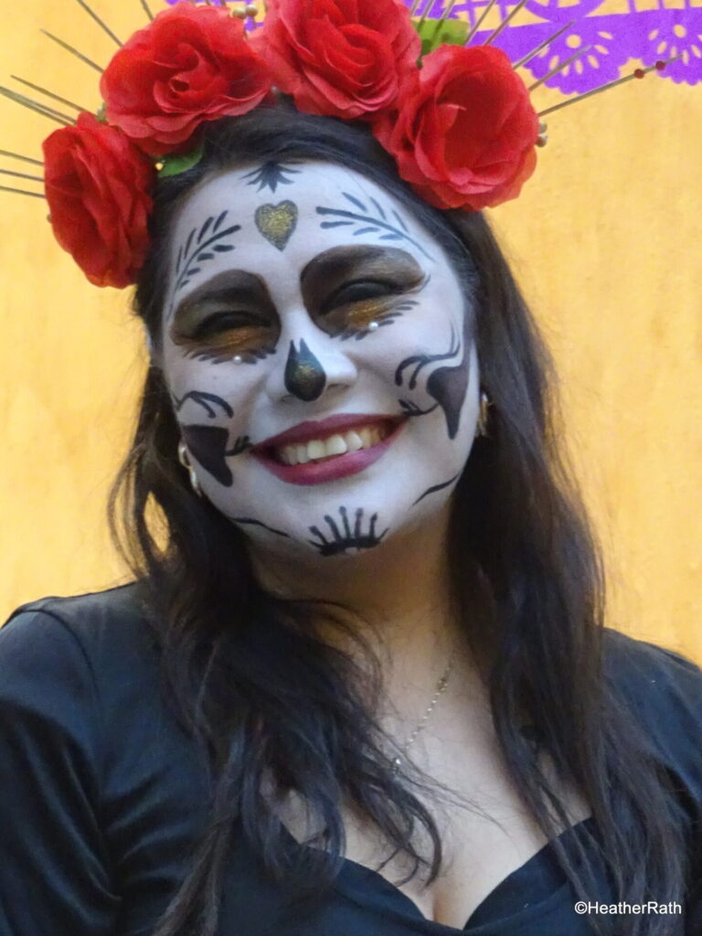 photo of a young woman with face made up celebrating the Mexican Day of the Dead. Experience culture as you spend a day in Aix en Provence