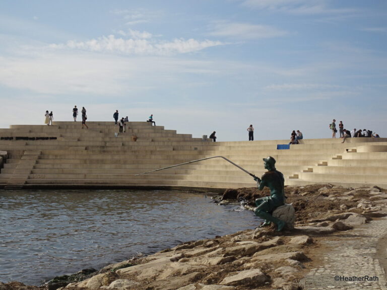 photo of sfinska steps with bronze fisherman