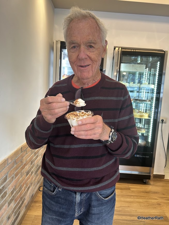 pic of Norm eating a yummy white mountain dessert