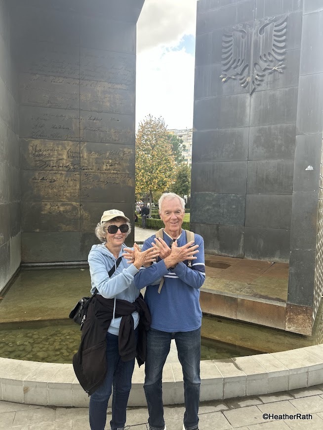 photo of Heather and Norm showing patriotic symbol with hooked thumbs and spread fingers